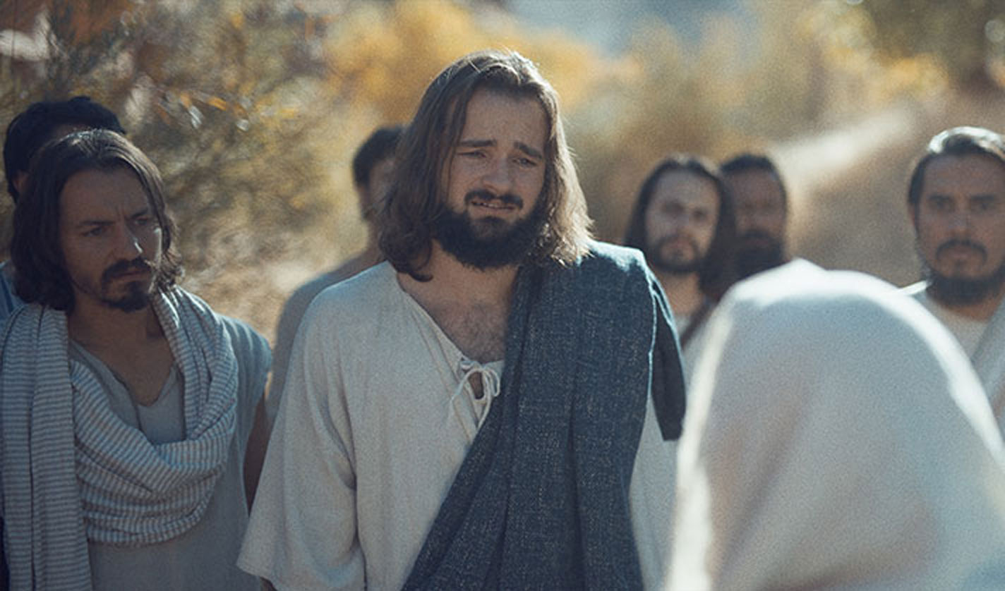 Jesus listens intently to a woman in this scene from ‘JESUS: a Deaf Missions film.’